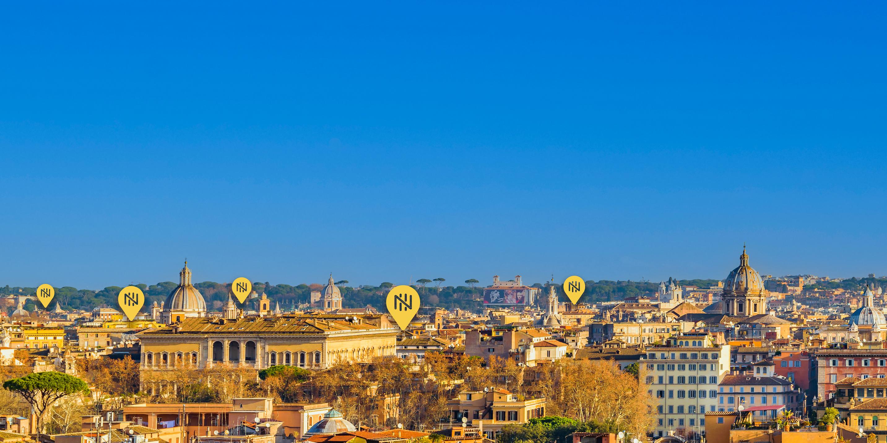 Nomad Guide — skyline de Roma com marcadores amarelos